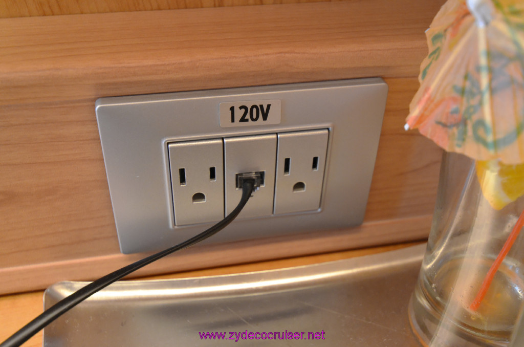 036: Carnival Sunshine Cruise, Barcelona, Embarkation, Cabin 120v outlets, plus there was an extra one behind the TV.